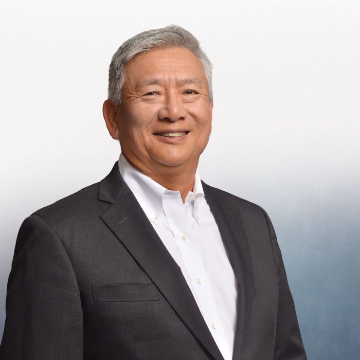 professional headshot of man in dark suit