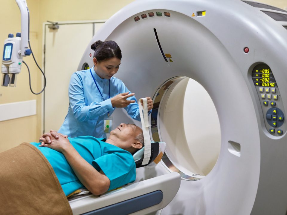 Nurse Preparing Patient For Cat Scan At Hospital
