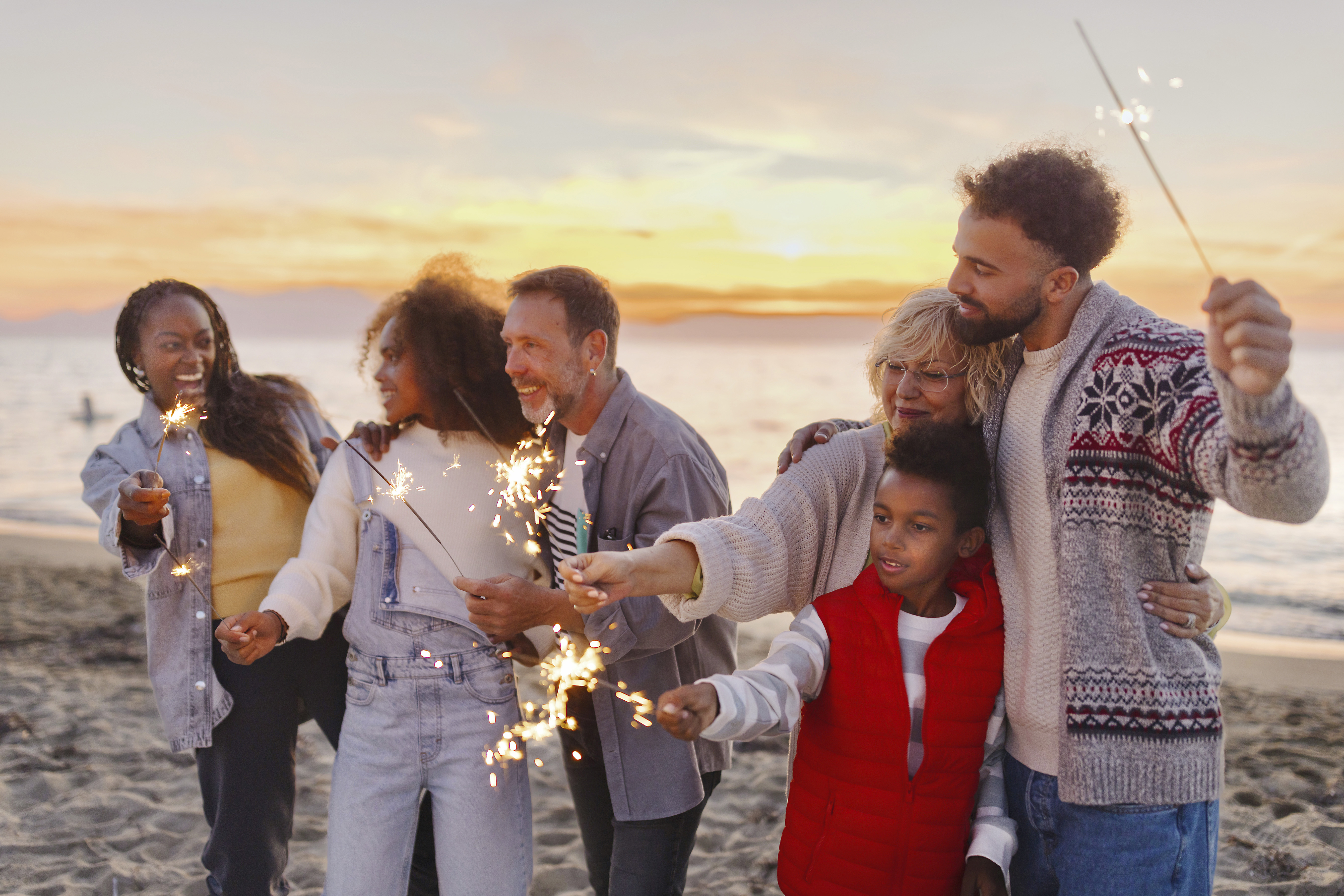 Family on the beach with sparklers