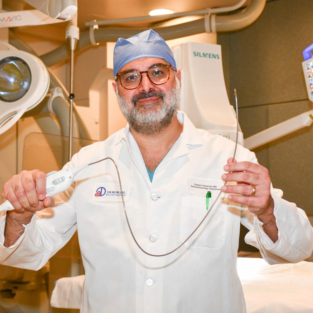 physician preparing to perform an interventional cardiology procedure -- cardiac catheterization