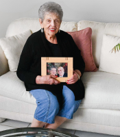 older woman sitting on couch